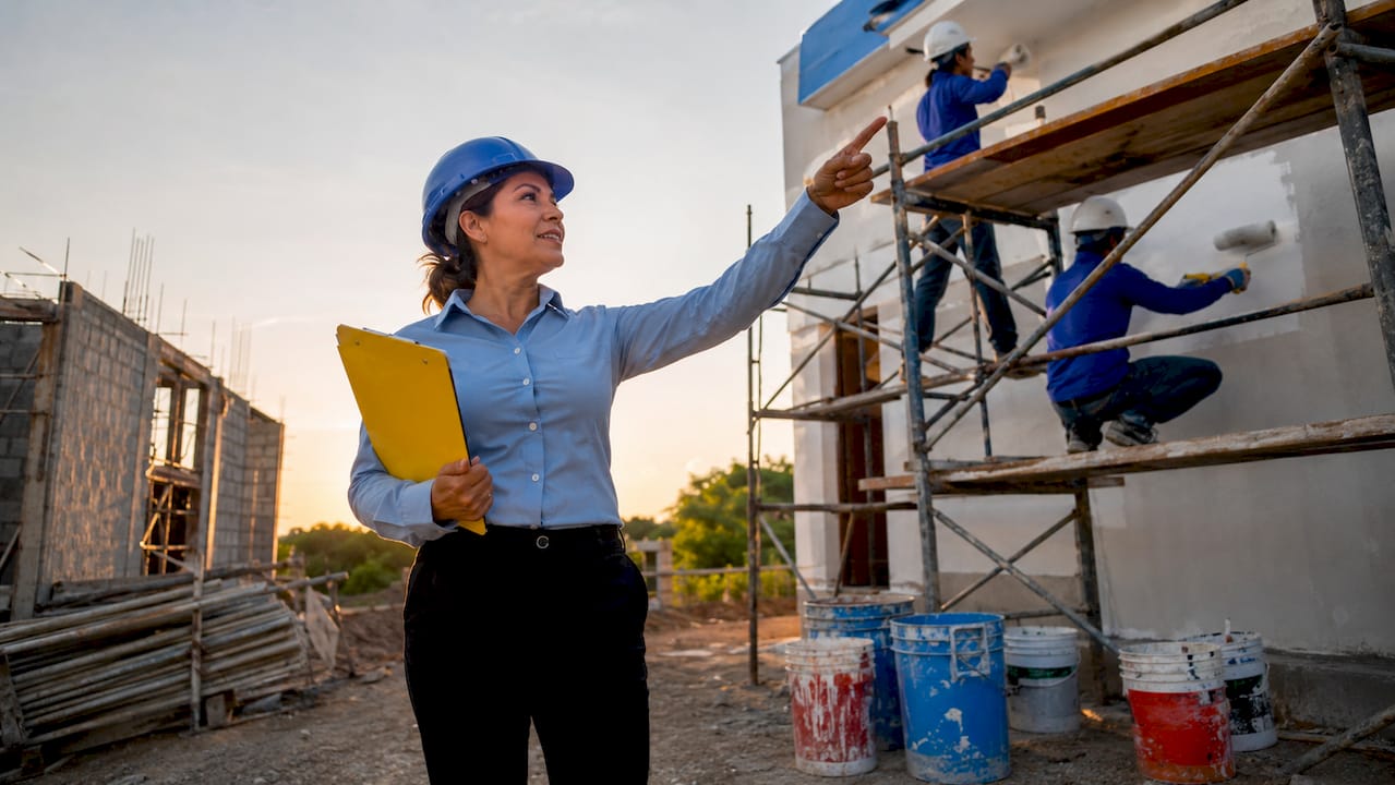 Facility manager inspecting painting safety measures