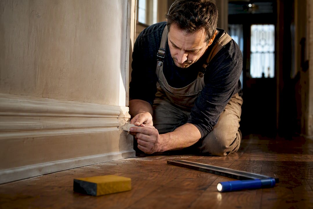 Repairing damaged skirting in period hallway