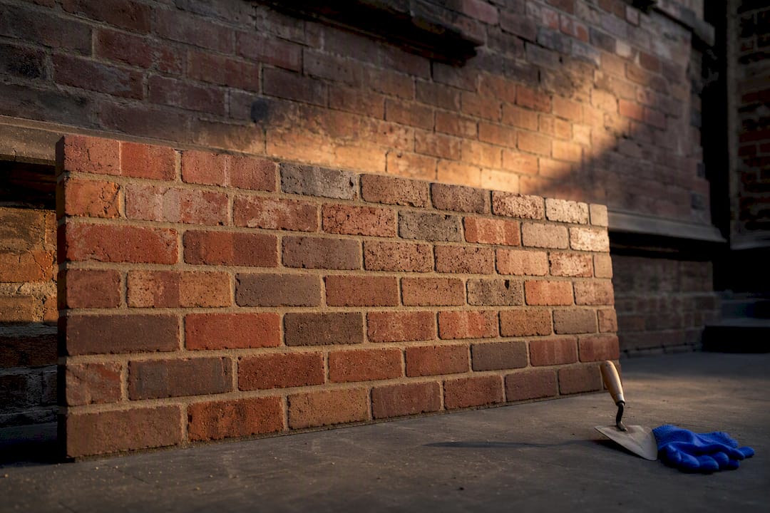 Brick sample panel beside heritage wall