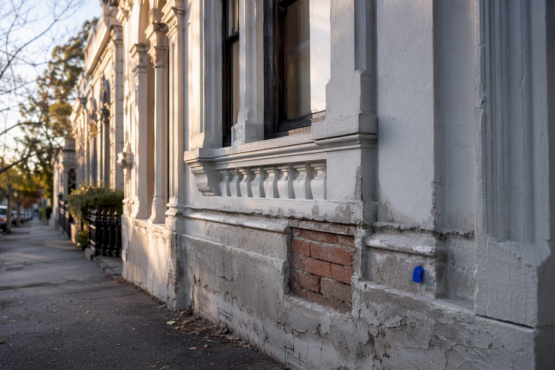 Victorian facade showing damp damage and repair