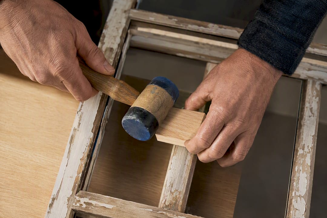 Offcut protecting sash stile from mallet