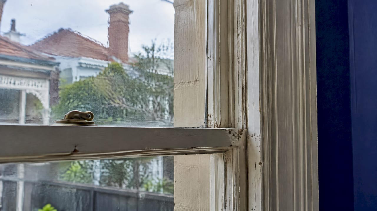 Wavy original glass in a timber sash window